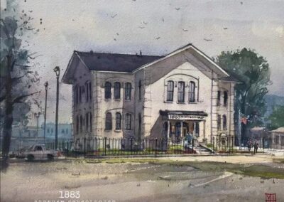 A watercolor painting of the Brenham Schoolhouse Hotel, capturing its historic architecture and charm.