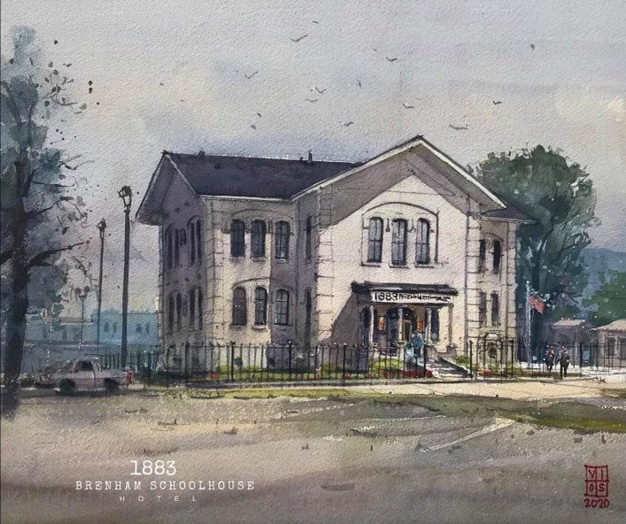 A watercolor painting of the Brenham Schoolhouse Hotel, capturing its historic architecture and charm.